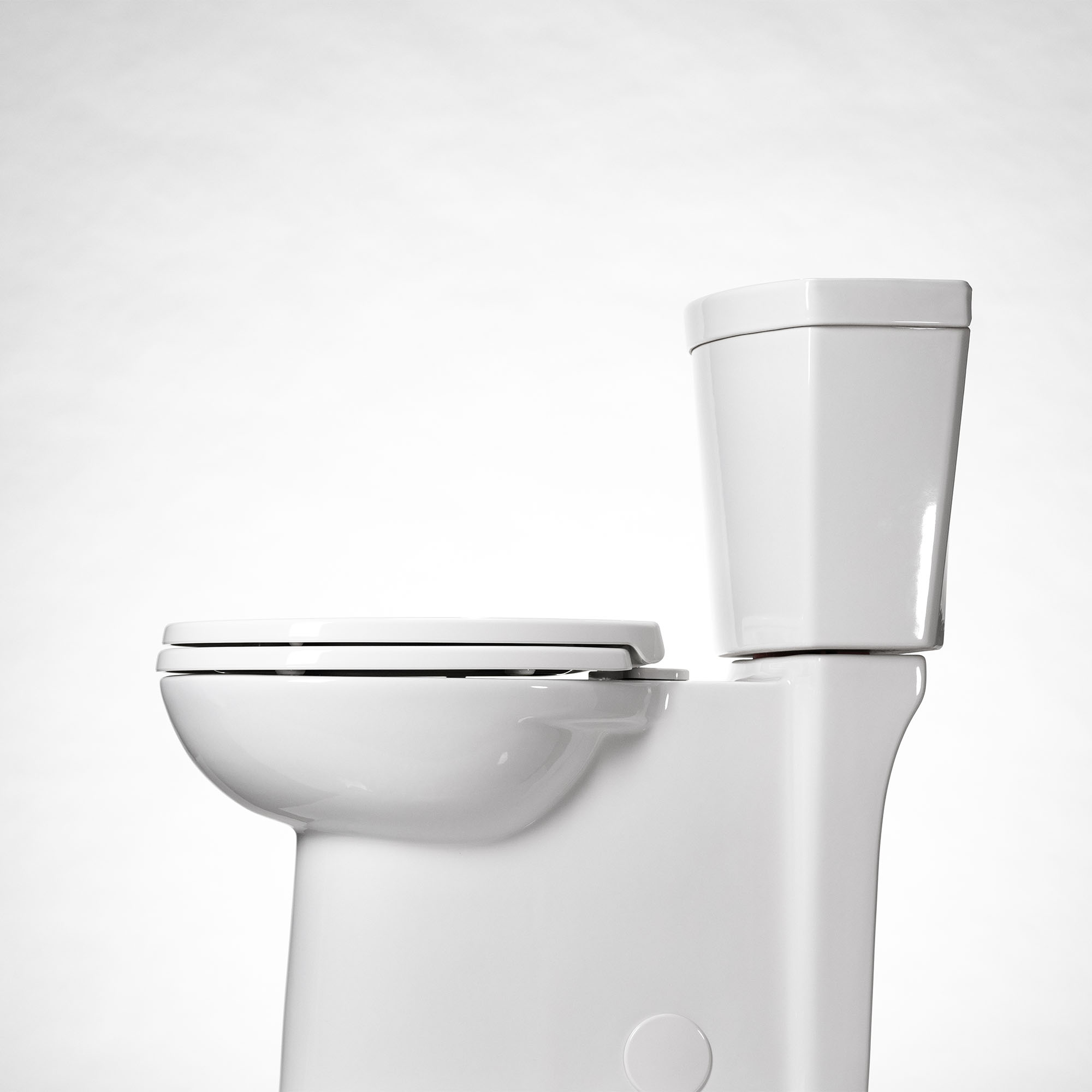 Studio Touchless Skirted Two-Piece 1.28 gpf/4.8 Lpf Chair Height Elongated Toilet with Seat